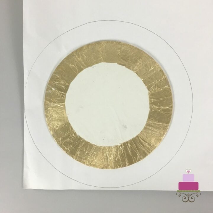 Cake board on a piece of paper