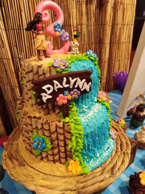 2 tier cake with waterfall design and Moana topper