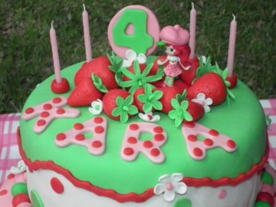 2 tier Strawberry Shortcake themed pink, green and white cake