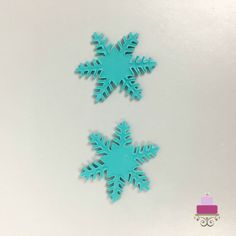 2 pieces of turquoise fondant cut outs