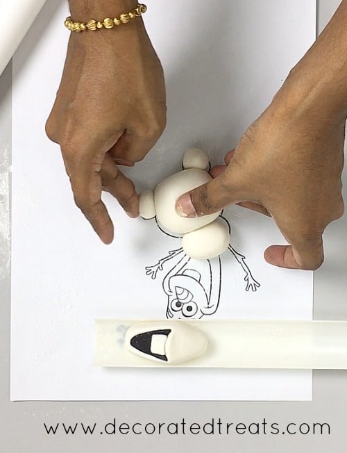 Shaping Olaf's feet.