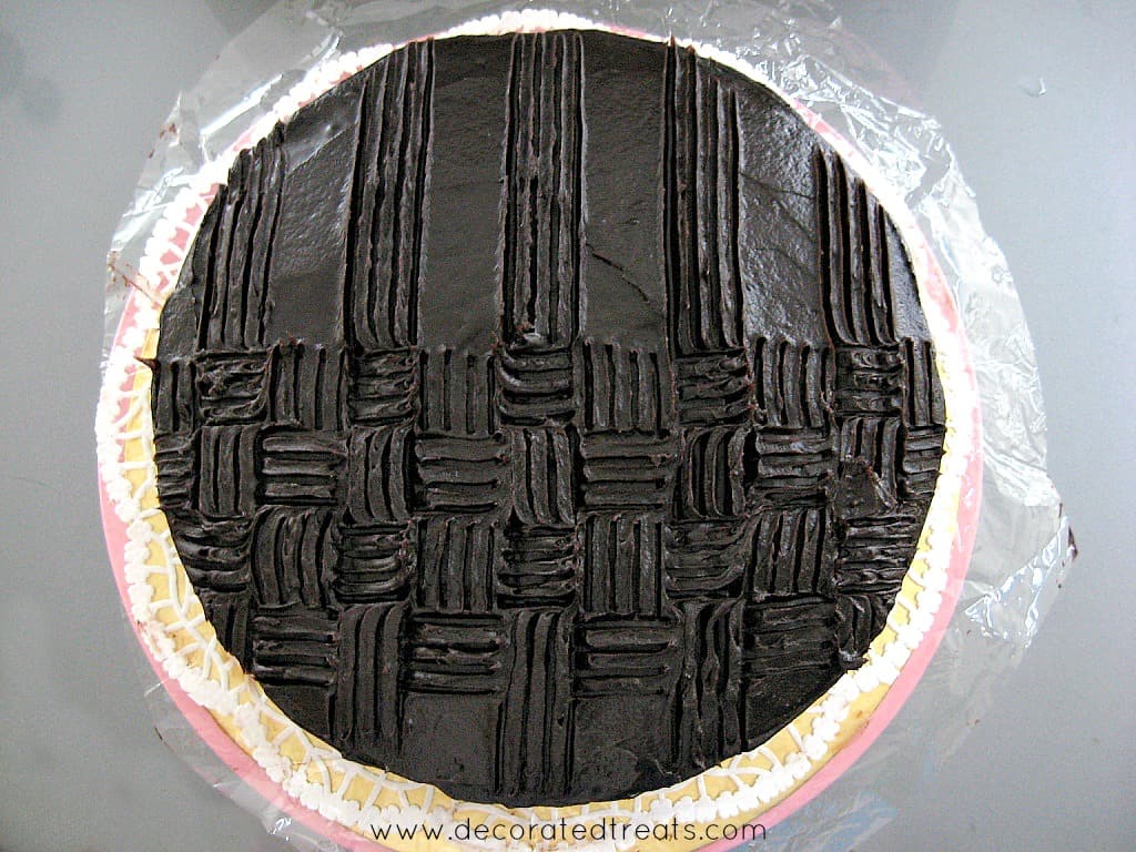 Basket weave pattern on a chocolate covered cake