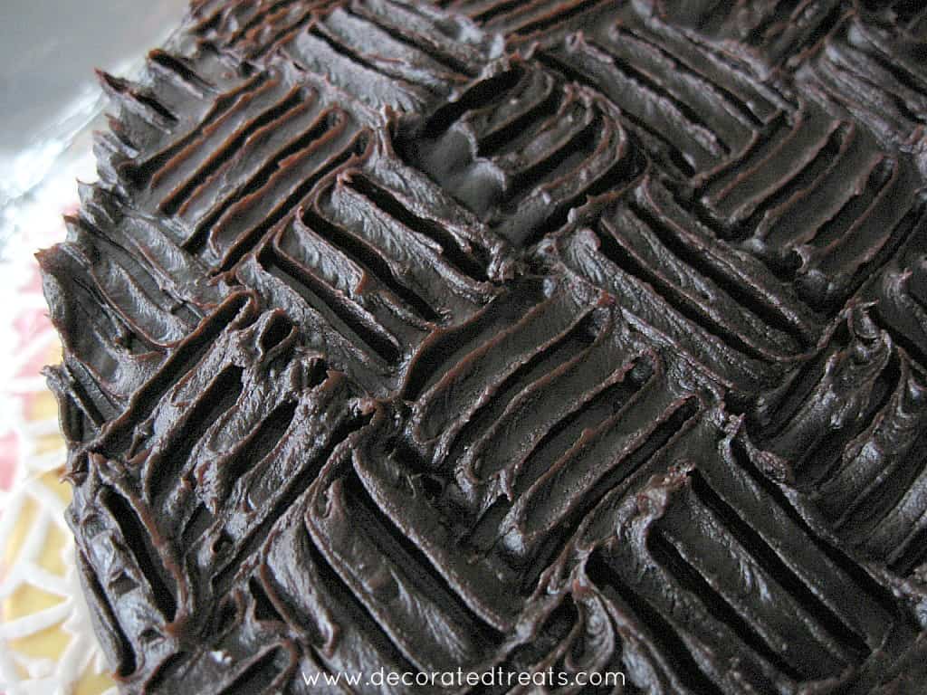 Chocolate cake with wide basket weave pattern