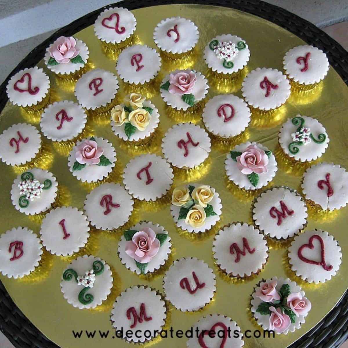 A set of happy birthday cupcakes with a combination of letters and floral design for mom