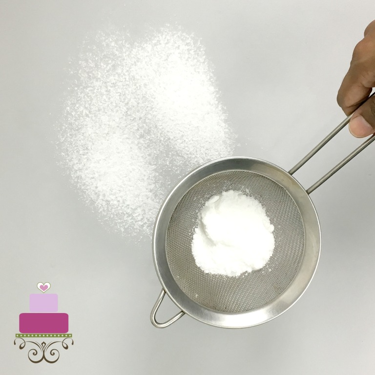 Powdered sugar in a sieve.
