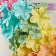 Colorful sugar flowers on a cake.