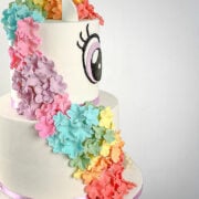 Colorful sugar flowers on a unicorn cake.