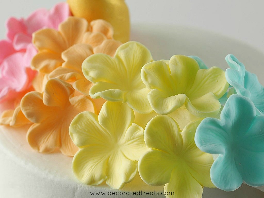 Colorful sugar flowers on a cake.
