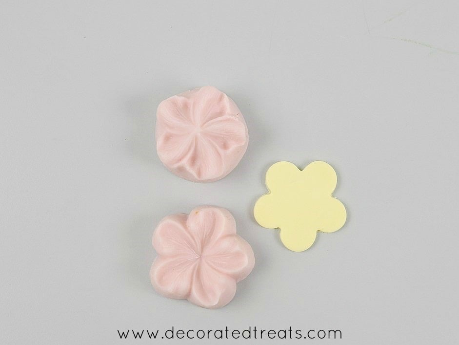 A 5 petal yellow fondant flower cut out with sugar blossom silicone molds