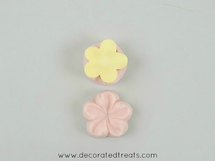 A 5 petal yellow fondant flower cut out with sugar blossom silicone molds.