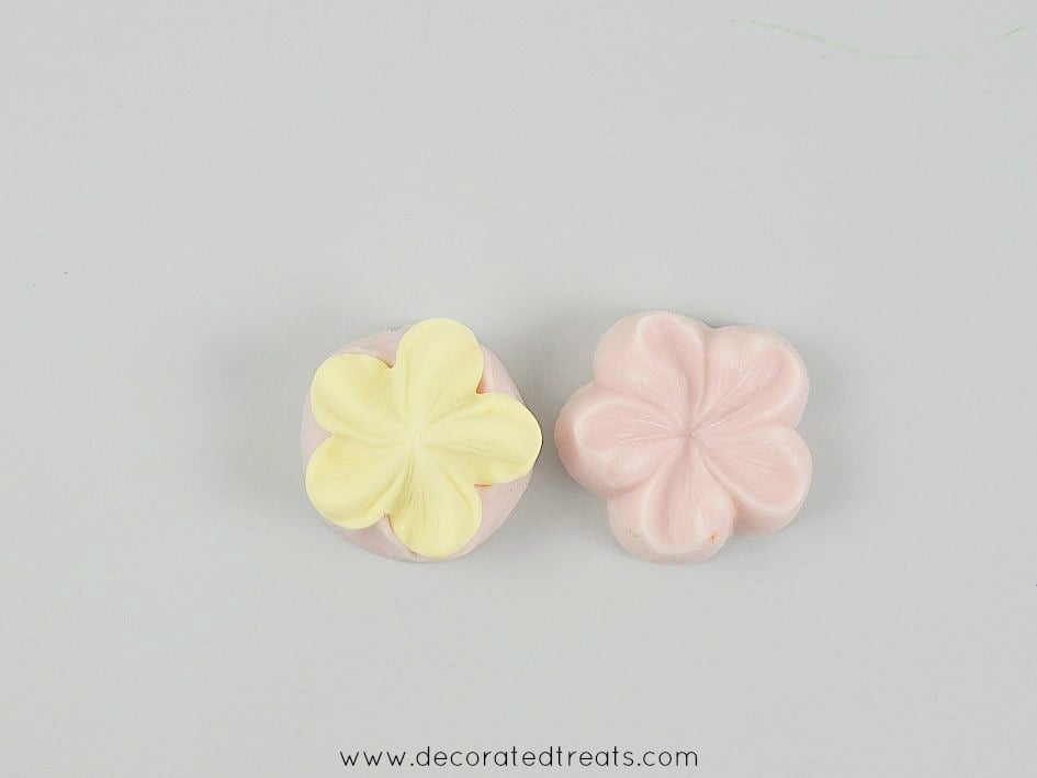 A 5 petal yellow fondant flower cut out with sugar blossom silicone molds
