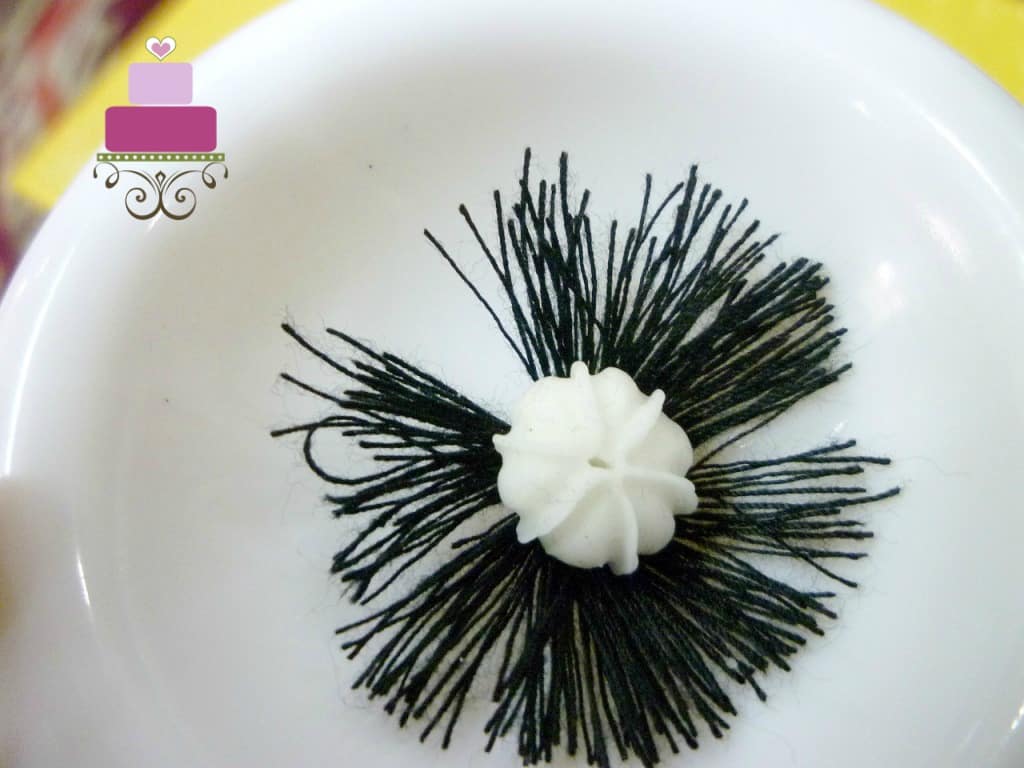 The black thread and white gum paste center of gum paste poppies