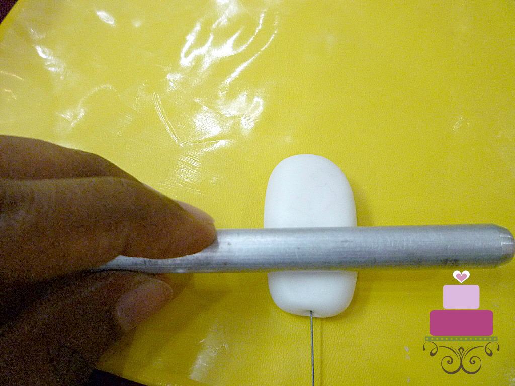 Rolling wired gum paste with a thin silver roller