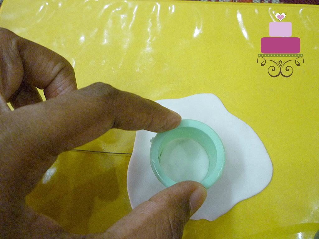 Cutting a gum paste petal with a round cutter
