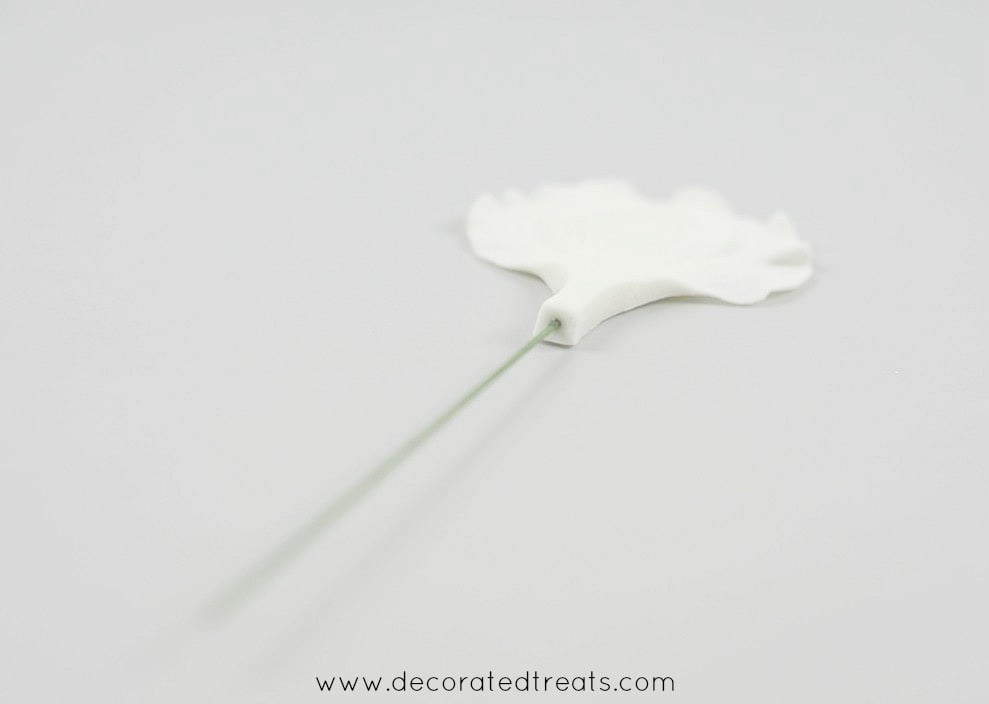 Wire inserted into a gum paste petal