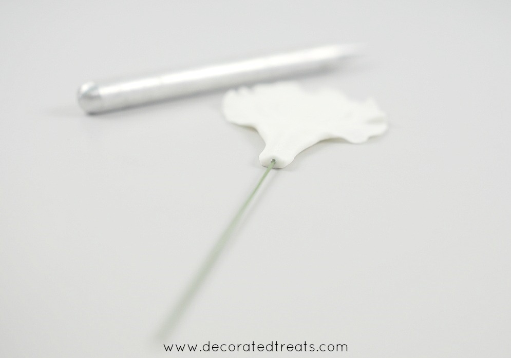 Wire inserted into a gum paste petal