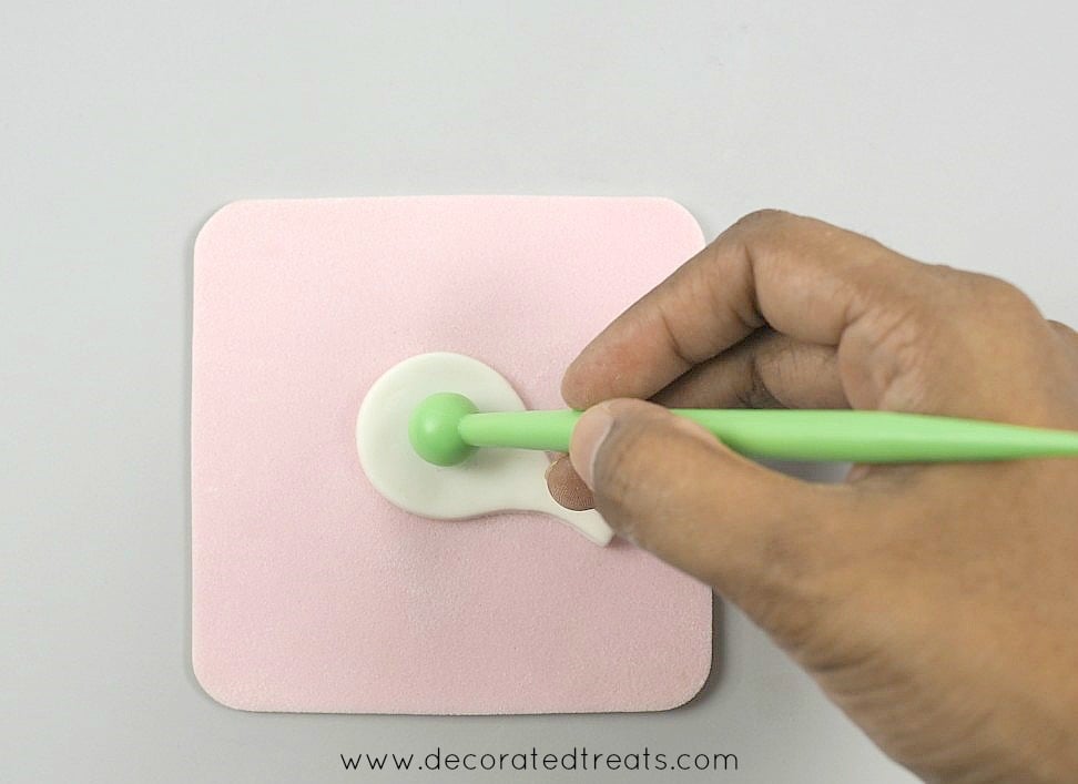 Using a ball tool to shape a gum paste petal