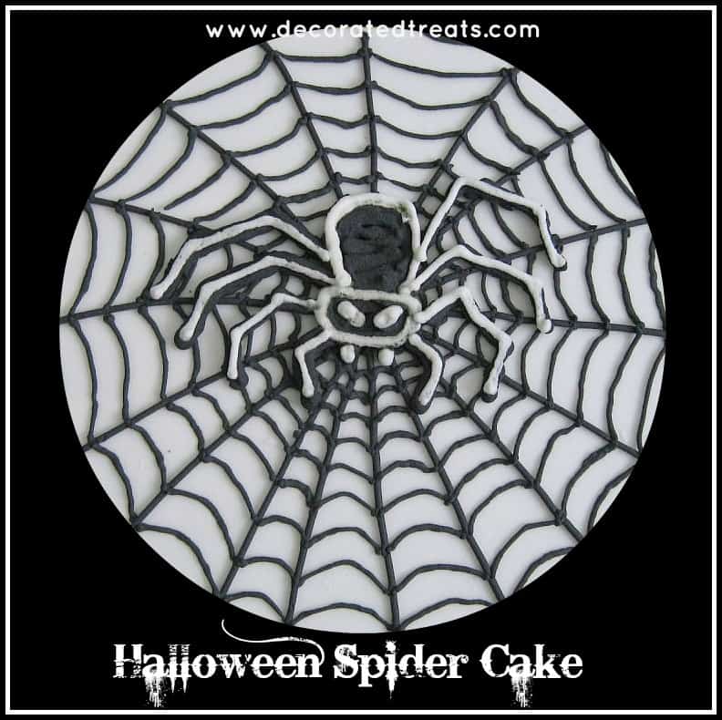 A royal icing spider motif on a cake
