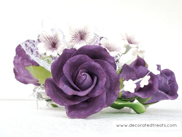 Purple gum paste roses in a bouquet