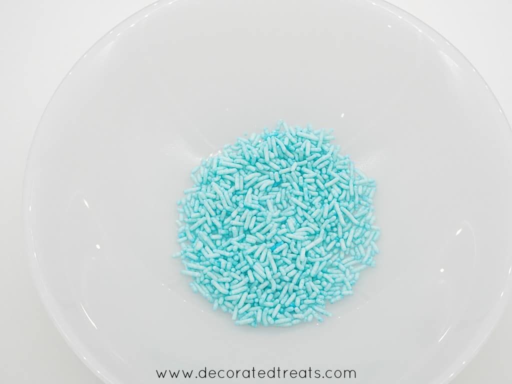 Light blue sprinkles in a white plate
