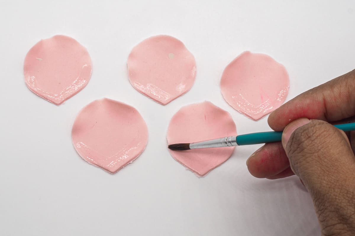 Apply glue to gum paste petals