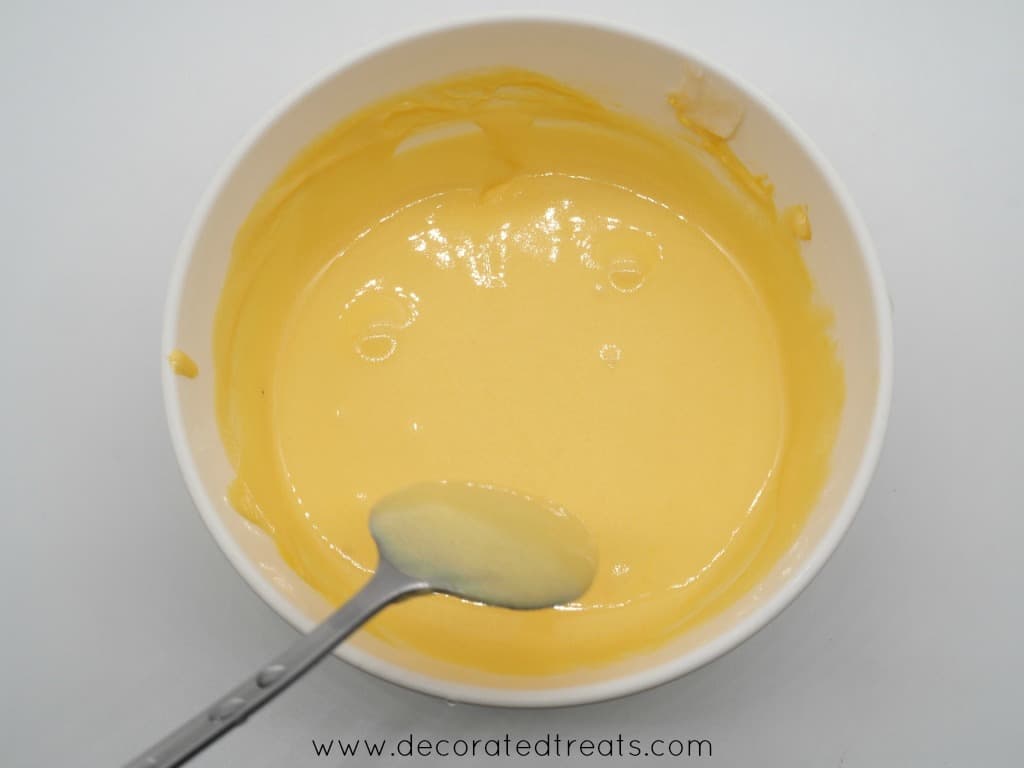 Yellow icing in a bowl