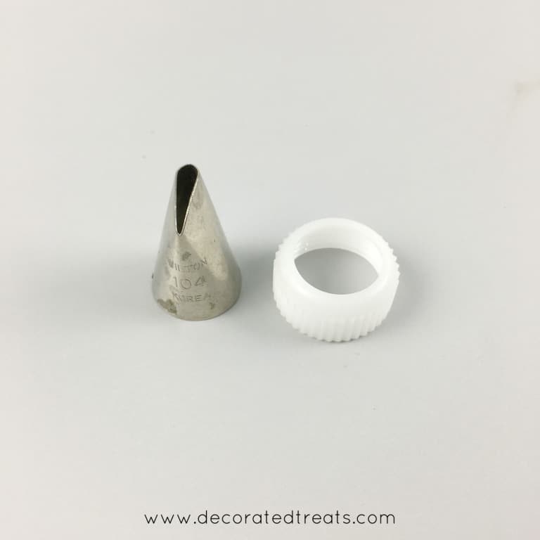 A petal piping tip and a coupler screw