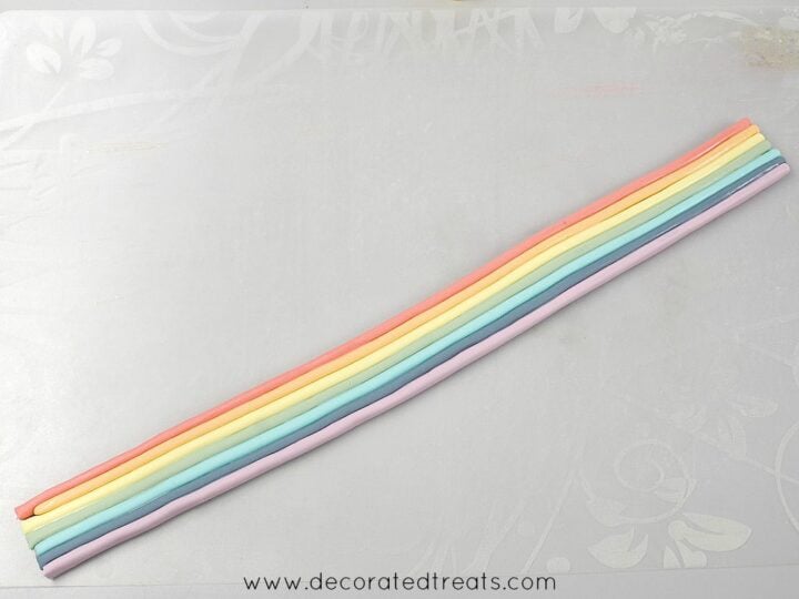A long strip of rainbow colored fondant