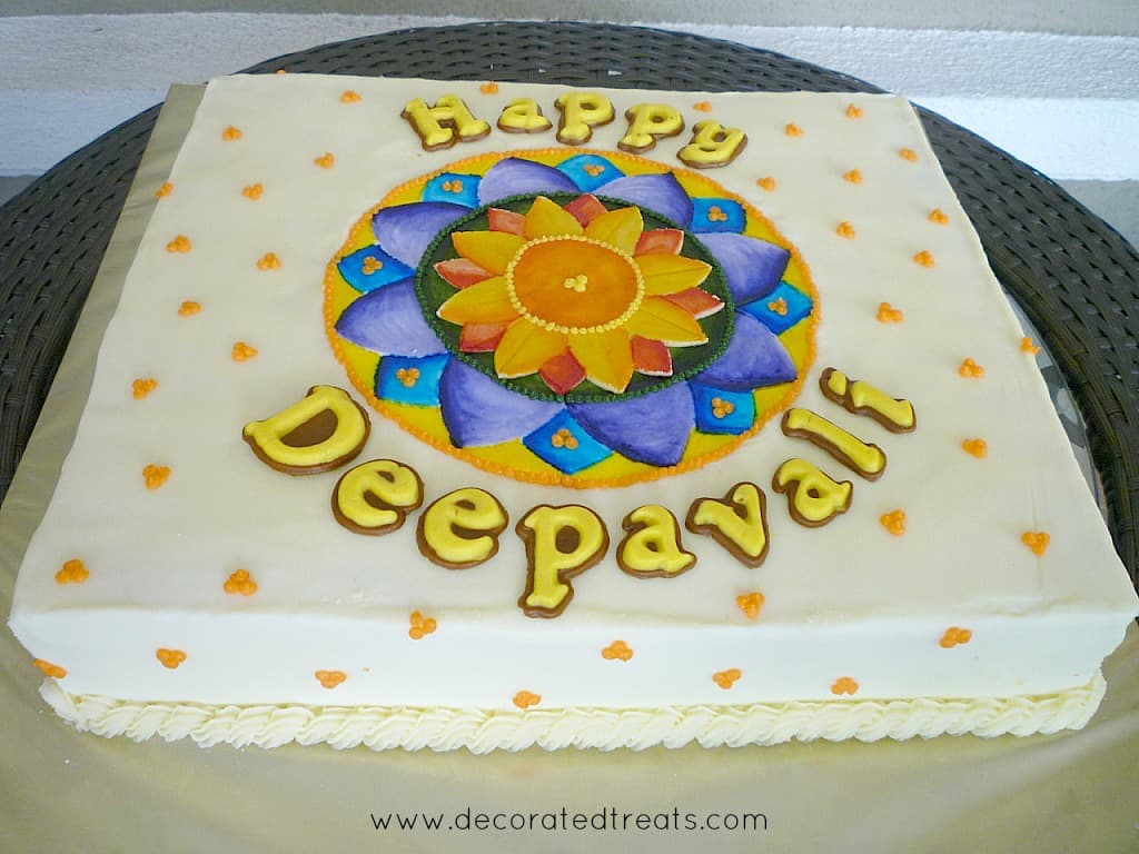 A rectangle cake with Rangoli design in blue and orange