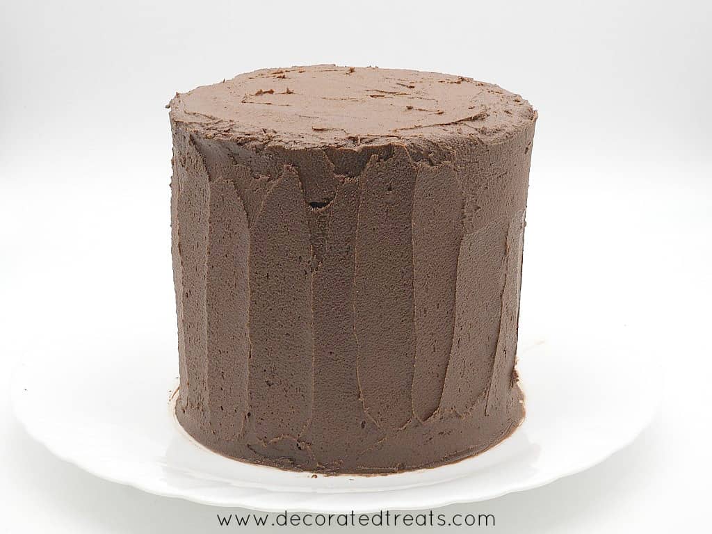 A round cake decorated in chocolate icing