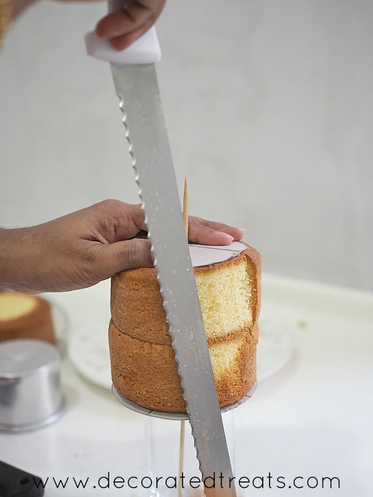Carving a cake with a long serrated knife