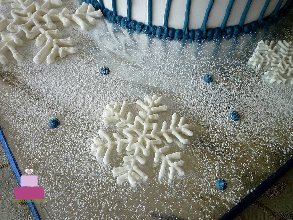 Royal icing snowflakes on a cake board