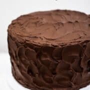 A cake covered in chocolate frosting.