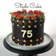 A 75th birthday cake in chocolate ganache decorated with fresh strawberries and butterscotch chips