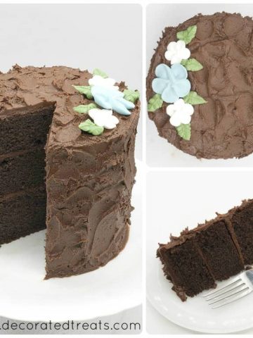A round chocolate cake decorated with chocolate icing and royal icing flowers. A slice of the cake is cut out