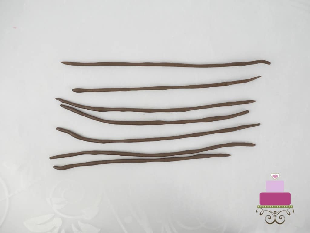 Long strips of thin brown fondant