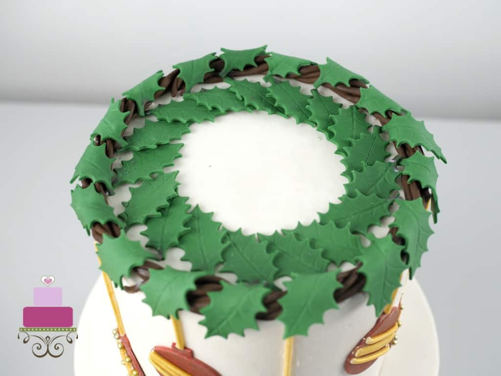 Holly leaves garland on a cake