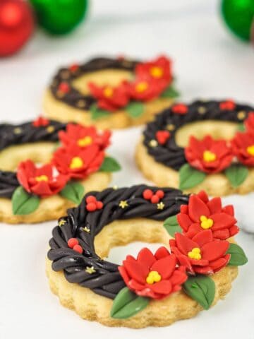 Christmas wreath sugar cookies decorated with fondant.