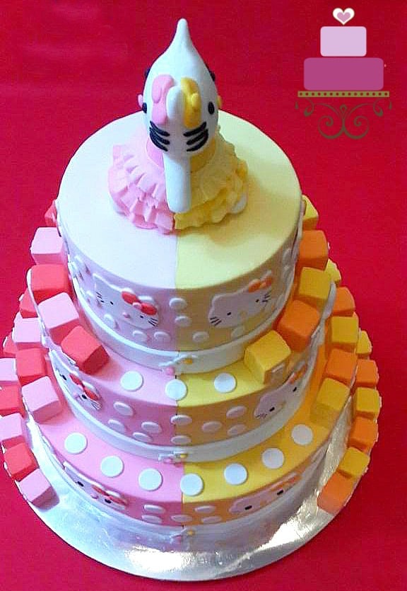 A dual toned Hello Kitty, 3 tier cake with Hello Kitty topper
