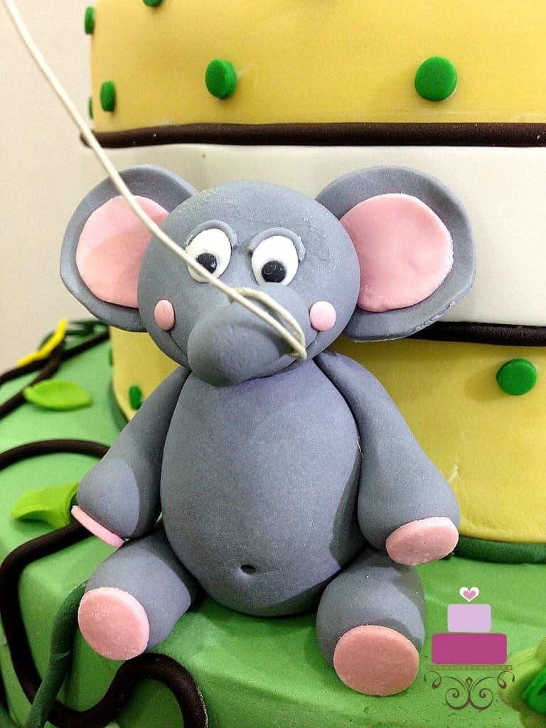 3d fondant elephant with a string around its trunk