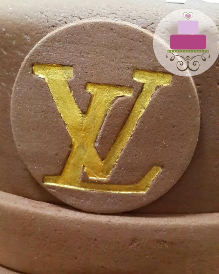 Louis Vuitton logo in gold on brown fondant