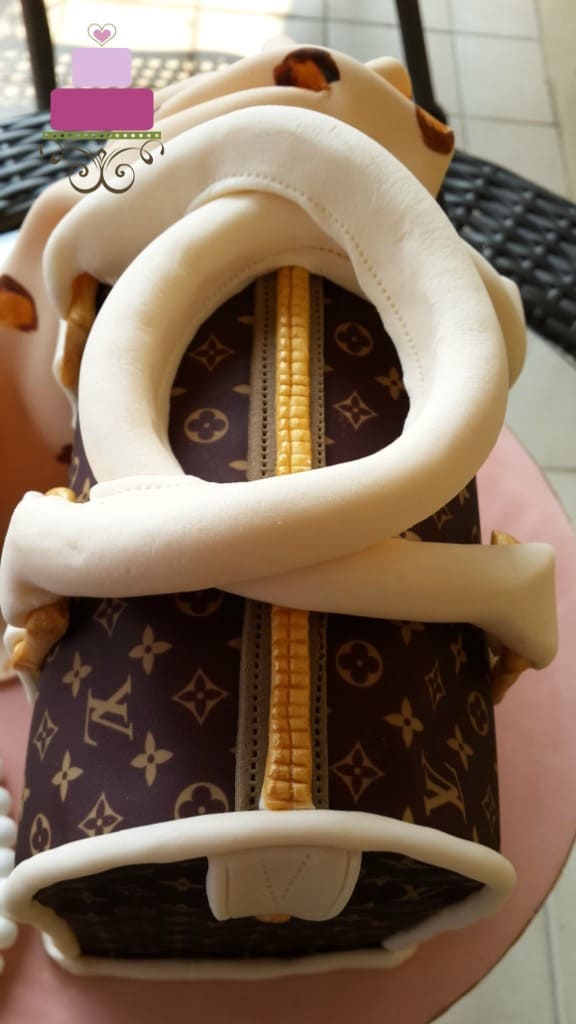 A Louis Vuitton inspired handbag cake.