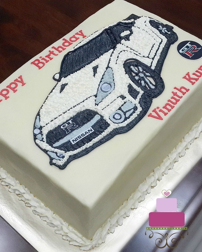 A rectangle cake decorated with Nissan GTR car image in buttercream