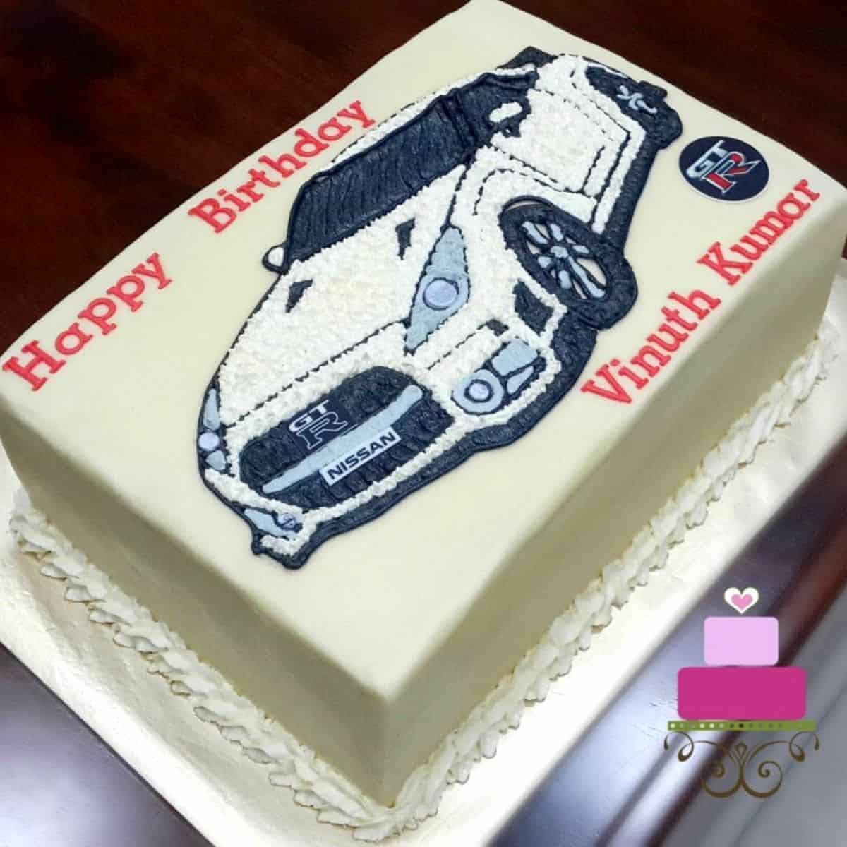 A rectangle cake decorated with Nissan GTR car image in buttercream