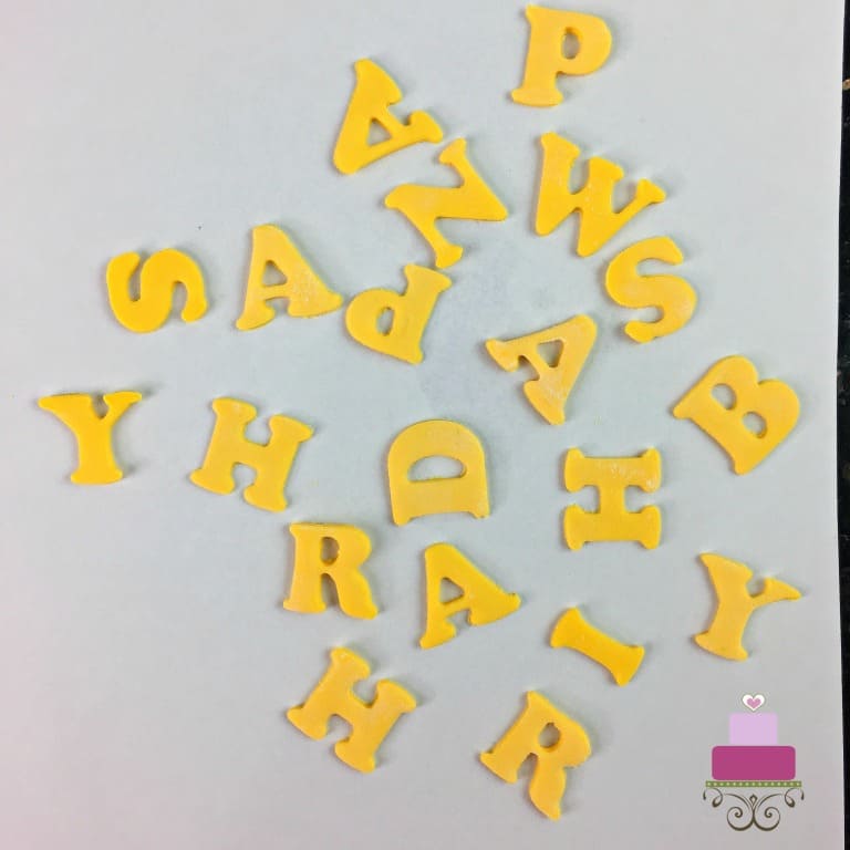 Fondant alphabets in yellow