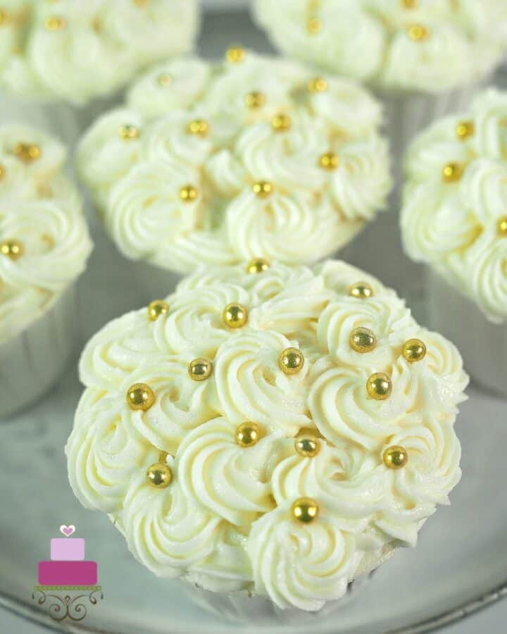 Cream cheese rosettes on a cupcake
