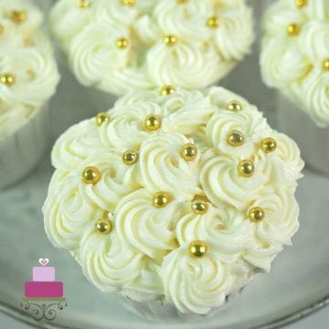 Cream cheese rosettes on a cupcake