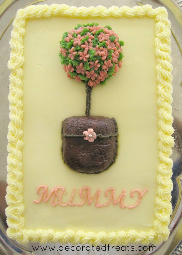 Poster for a rectangle cake decorated with buttercream topiary in pink