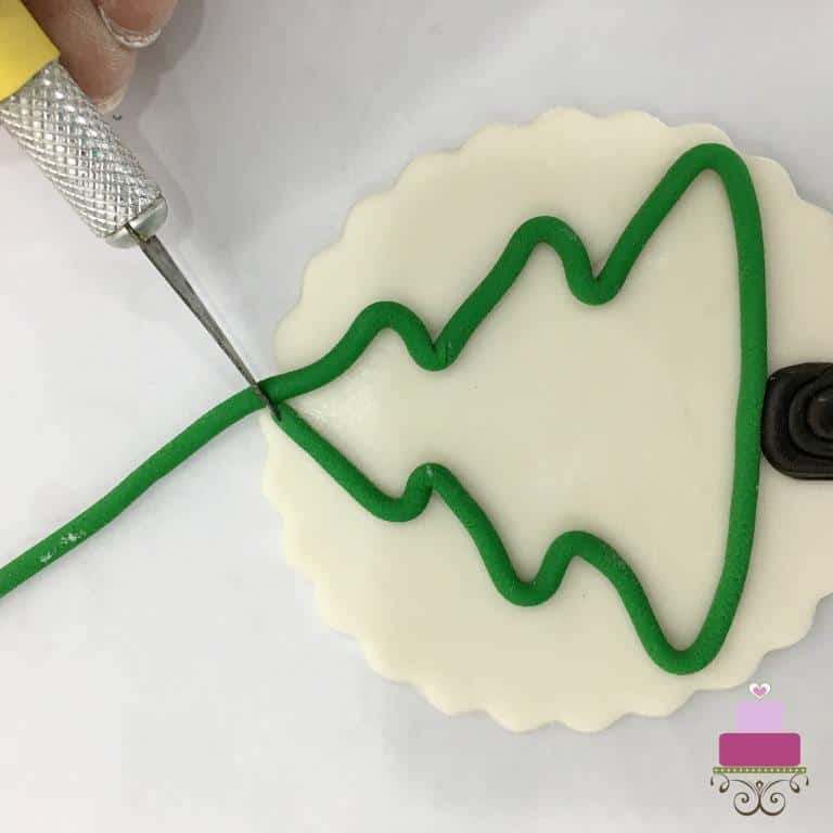 Making the Christmas tree outline with green fondant