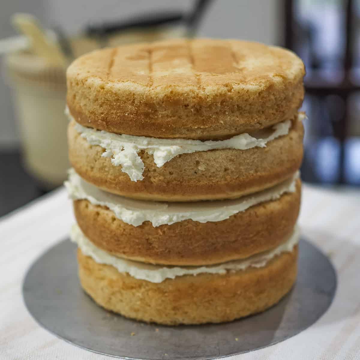 4 layers of cake stacked with buttercream filling